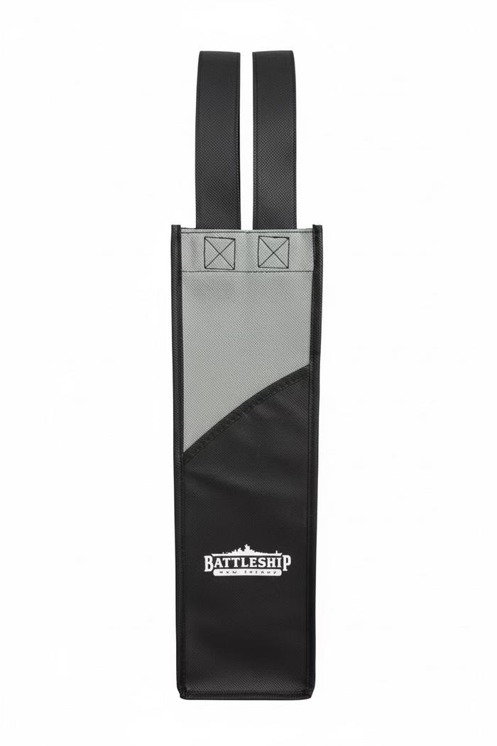 Close-up of a gray wine bottle bag with the text 'BATTLESHIP NJ' printed on it, featuring a section resembling a mesh pocket and a strap for carrying.