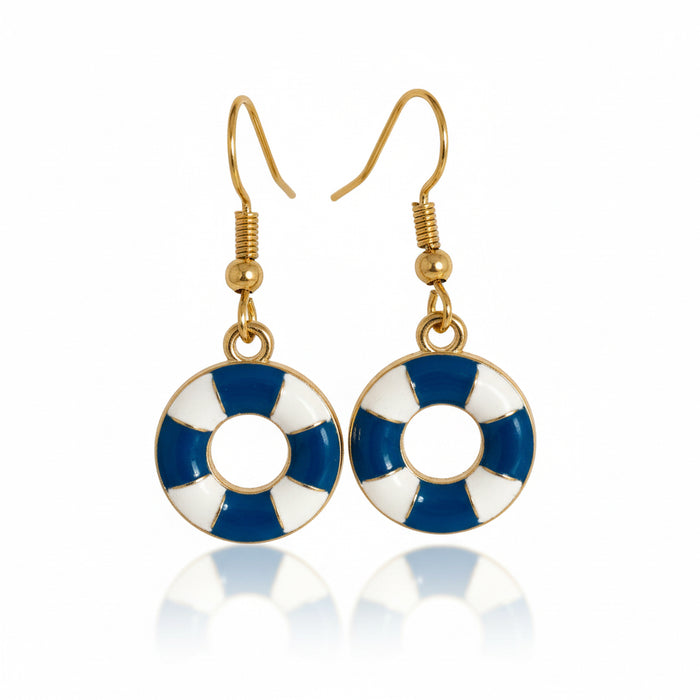 Pair of earrings with blue, white, and gold design on a brown background