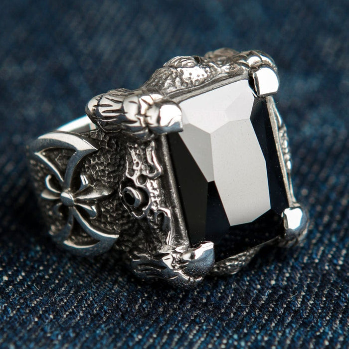 A gothic-style sterling silver dragon claw ring, featuring a rugged, scaly band and a huge black CZ stone.