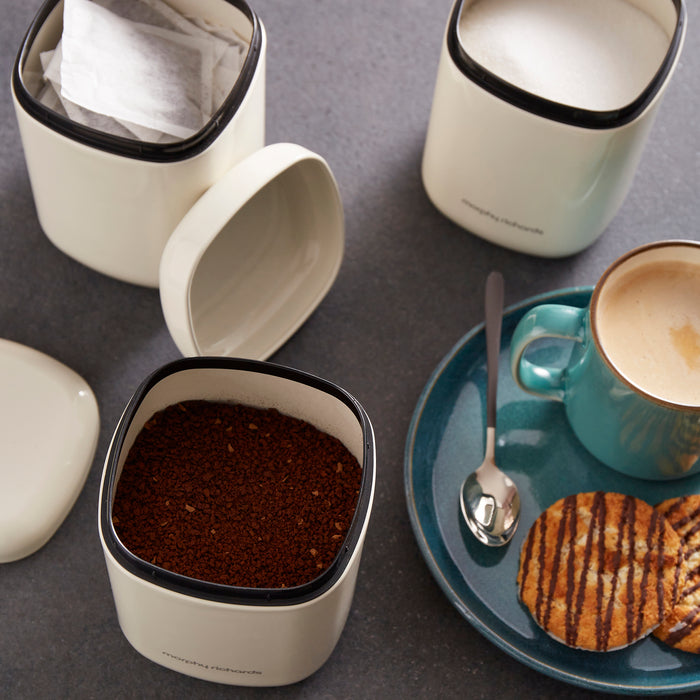 Coffee, sugar and tea bags stored inside the canisters