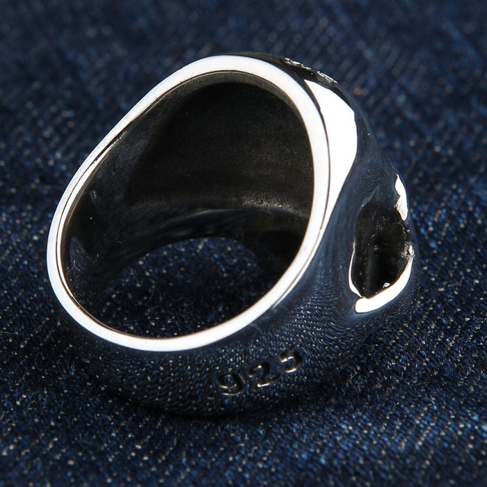 Inverted view of the handcrafted silver skull ring displaying its smooth polished interior and deep hollow back construction.