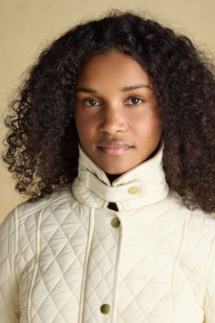 Shop the Joules Highclere showerproof diamond quilted jacket — a stylish and practical layer with cord collar, welt pockets and adjustable waist, perfect for rainy days. Shop Joules at Dotique.