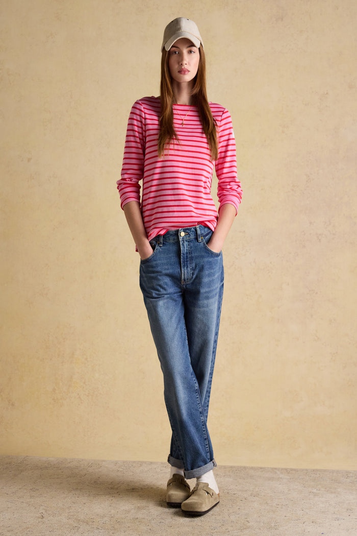 A timeless classic with a fresh pop of colour, the Joules Harbour Breton top in pink and red stripe is one of those pieces that never dates. Shop Joules at Dotique.