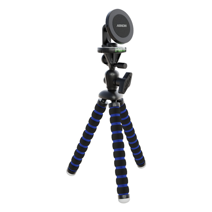 The Magnetic Phone Holder with 11 Flexible Tripod—MagSafe Compatible features blue and black striped flexible legs and securely holds smartphones or cameras with its round, Arkon-branded magnetic mount. Ideal for content creators.