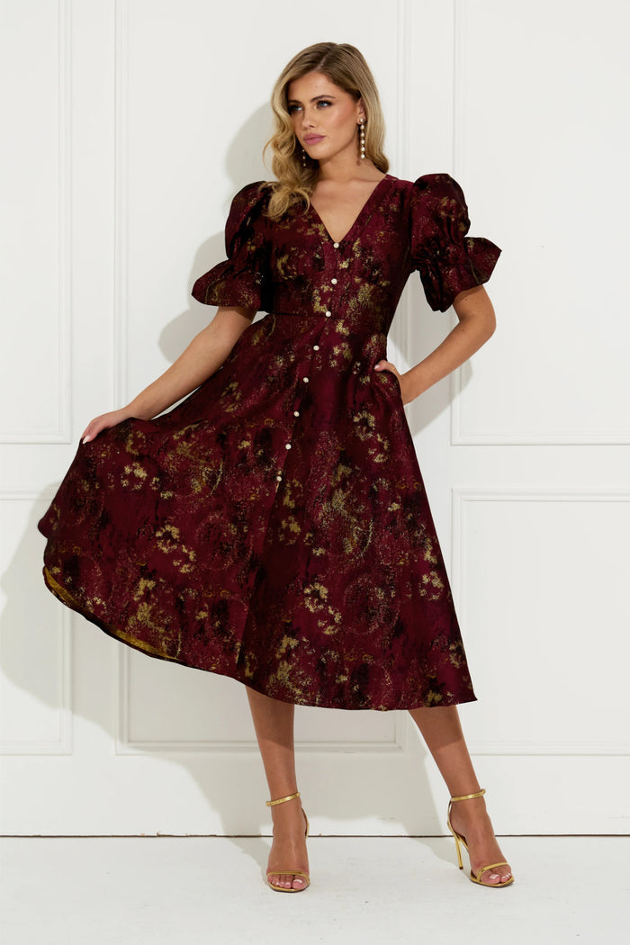 Model wearing 8th Sign Callie Button Dress Oxblood. Shop 8th Sign at Dotique.