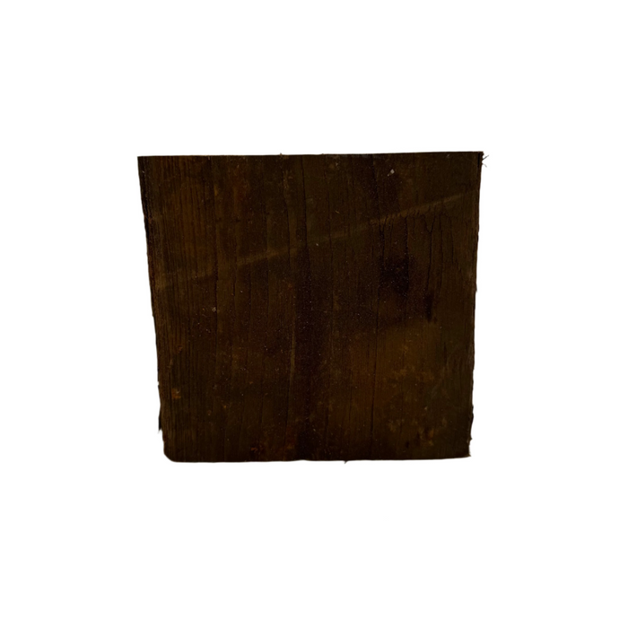 A piece of assorted unfinished teak wood with a rustic and natural appearance.