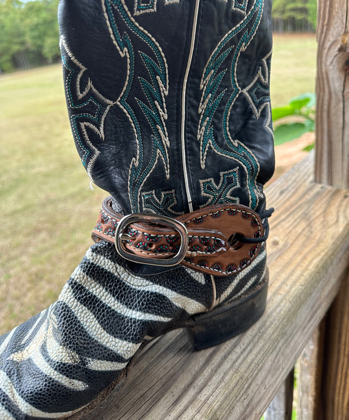 Hand tooled and painted spur straps