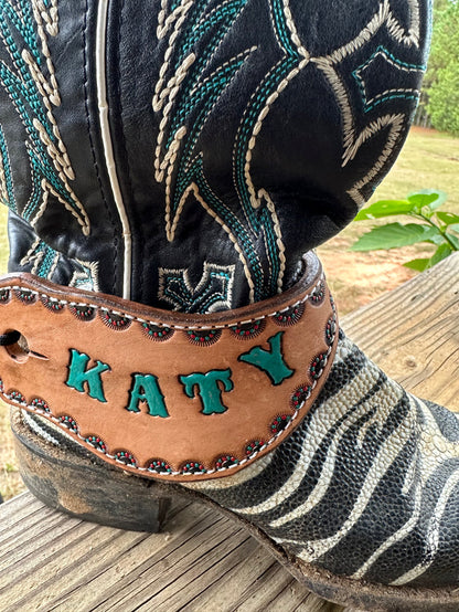 Hand tooled and painted spur straps