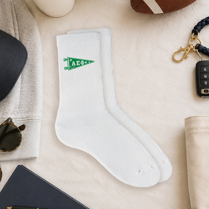 Alpha Epsilon Phi collegiate pennant crew socks styled in a sorority flat lay with Greek life accessories