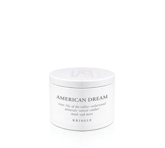 White candle tin container labeled 'American Dream' by Kringle on a white background