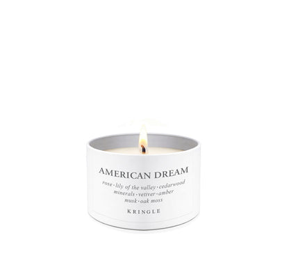Kringle Candle with 'American Dream' scent in a tin candle container a white background