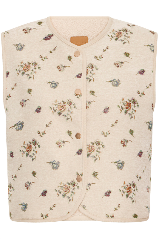 Atelier Rêve Irtambourine jacquard floral waistcoat with a loose, cropped fit. A beautiful layering piece to elevate everyday outfits. Shop at Dotique.