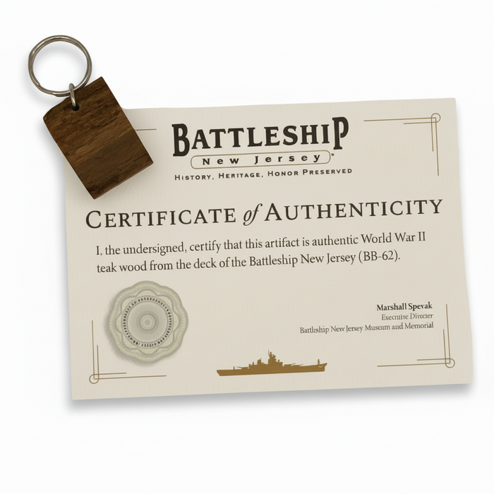 Certificate of Authenticity for World War II teak wood from the Battleship New Jersey with a keychain attached.