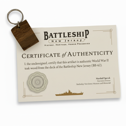 Certificate of Authenticity for World War II teak wood from the Battleship New Jersey with a keychain attached.