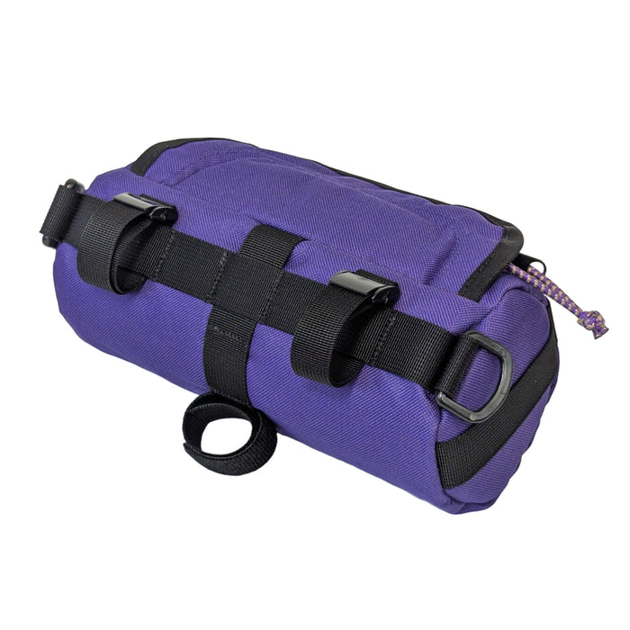 purple handlebar bag on white - back