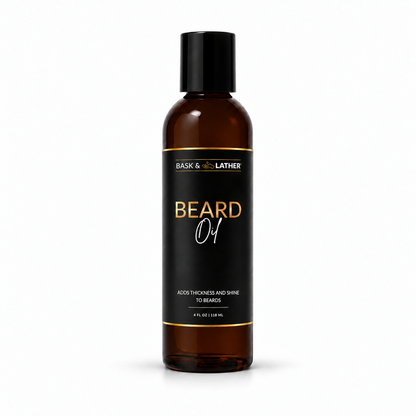 A 4 fl oz amber glass bottle of Bask & Bother Beard Oil with a black cap and black label featuring gold and white text, set against a plain white background.