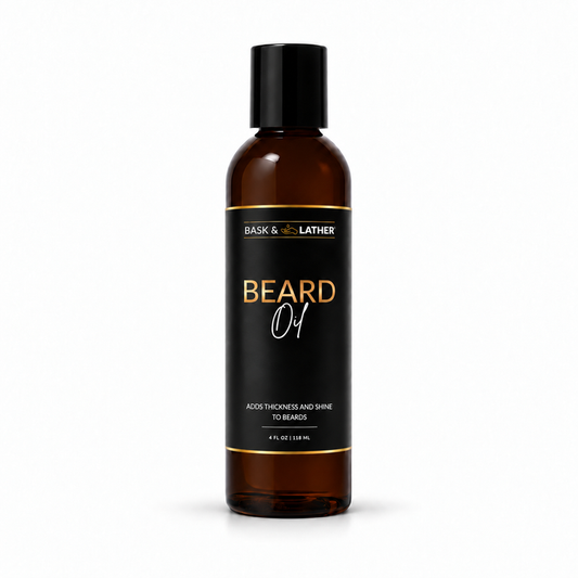 A 4 fl oz amber glass bottle of Bask & Bother Beard Oil with a black cap and black label featuring gold and white text, set against a plain white background.