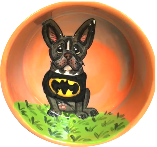 photo of orange ceramic pet bowl with bat dog French bulldog or Boston Terrier in batman dog shirt costume, by Debby Carman, faux paw petique