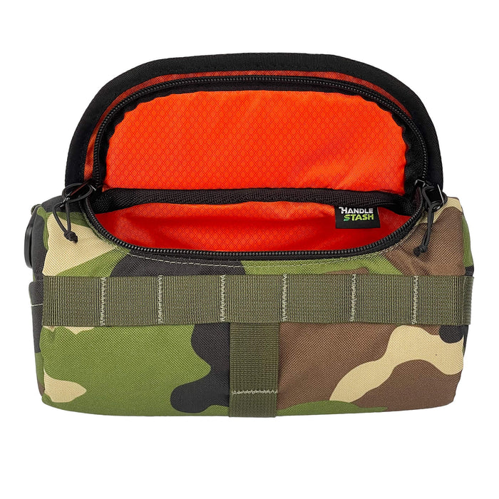 Camouflage HandleStash handlebar bag unzipped with blaze orange liner.