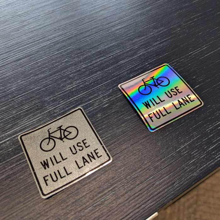 reflective bike sticker on left and holographic bike sticker on right