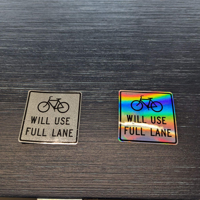reflective bike sticker (left) and holographic bike sticker (right) side by side