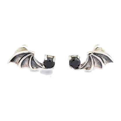Black CZ bat wing stud earrings in .925 sterling silver, mirrored pair shown front-on with both stones facing inward
