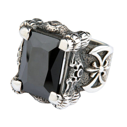 A side profile view of the dragon claw ring, highlighting the intricately engraved warrior's battle axe emblem on the band.