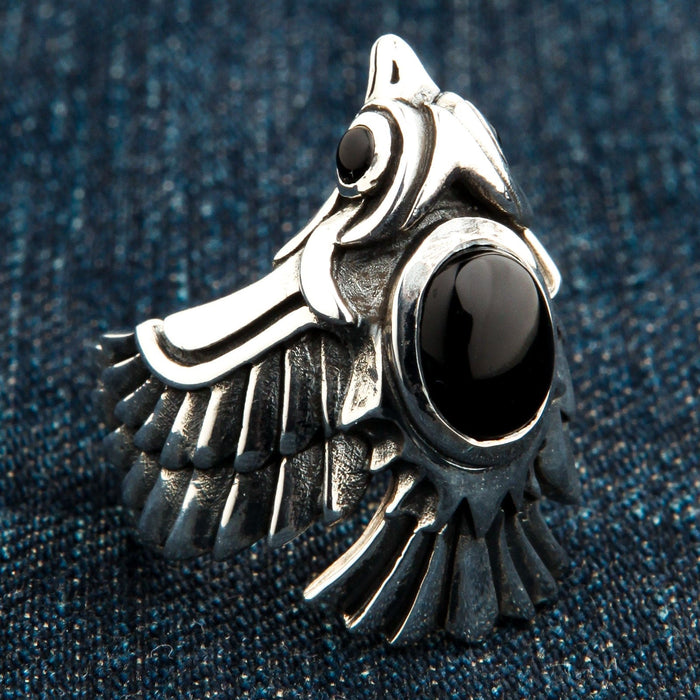 A side profile of the heavy silver phoenix wrap ring, highlighting the intricate wing and feather details.