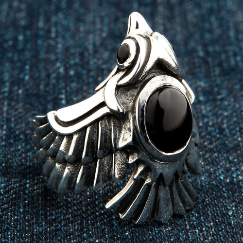 A side profile of the heavy silver phoenix wrap ring, highlighting the intricate wing and feather details.
