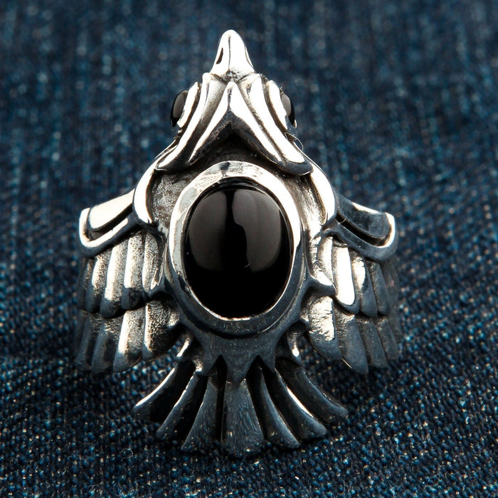 A front view of the sterling silver black onyx phoenix ring, showing the detailed head and feathered band.