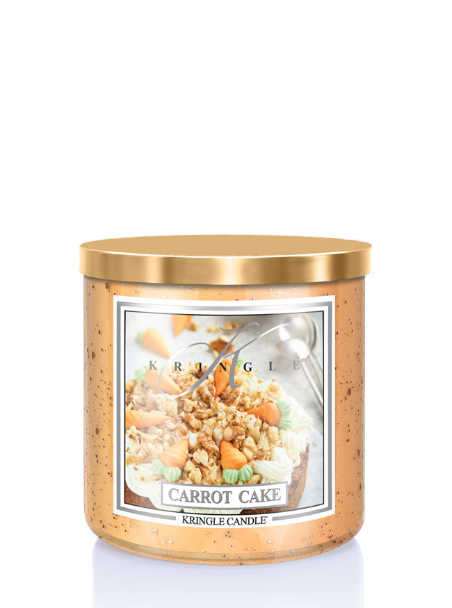 Kringle Candle Carrot Cake candle with gold lid on a white background