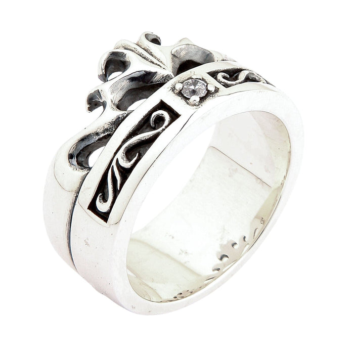 Close-up angle revealing the thick polished silver base below a recessed oxidized knotwork channel and cubic zirconia.