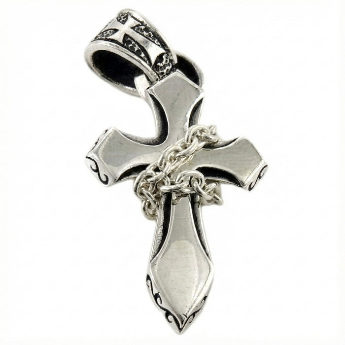 Front view showing the thickness of the silver cross pendant.