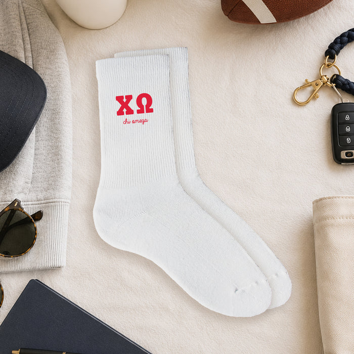 Chi Omega crew socks styled in a sorority flat lay with Greek life accessories and campus-inspired décor