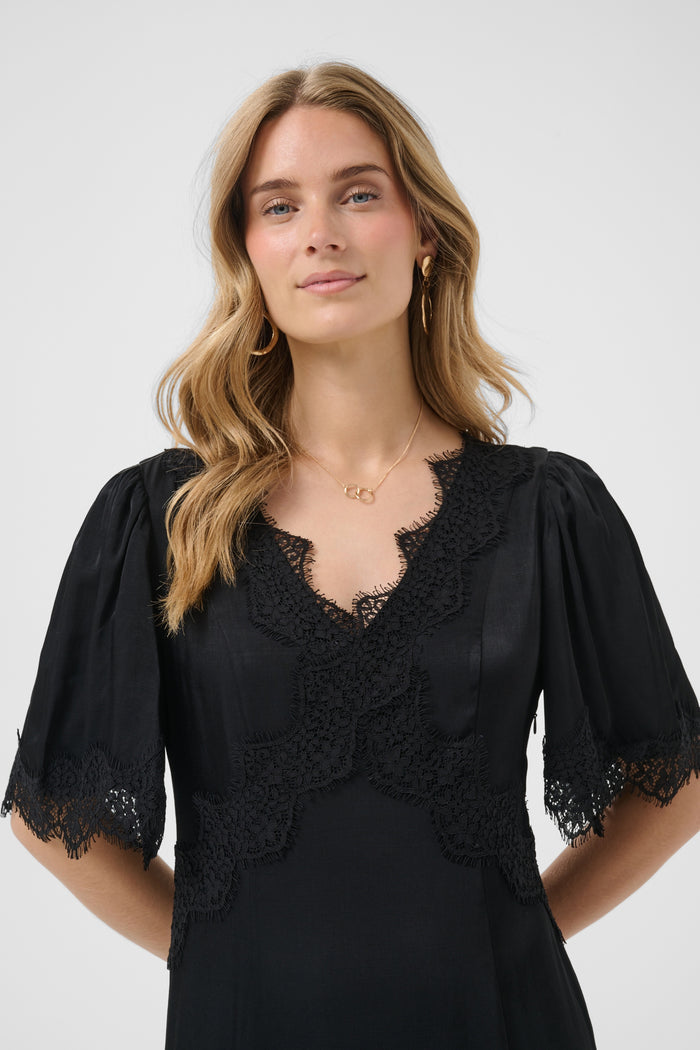 Cream 10615319 Confir Lace Maxi Dress Black with lace details on model. Shop Cream at Dotique.