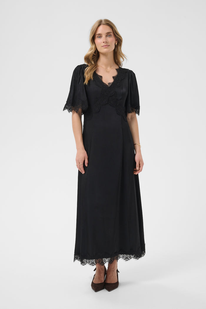 Cream 10615319 Confir Lace Maxi Dress Black on model with lace trim. Shop Cream at Dotique.