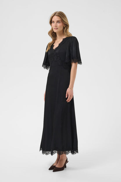 Cream 10615319 Confir Lace Maxi Dress Black on model. Shop Cream at Dotique.