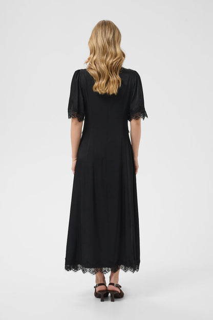 Cream 10615319 Confir Lace Maxi Dress Black on model from behind with lace trim. Shop Cream at Dotique.