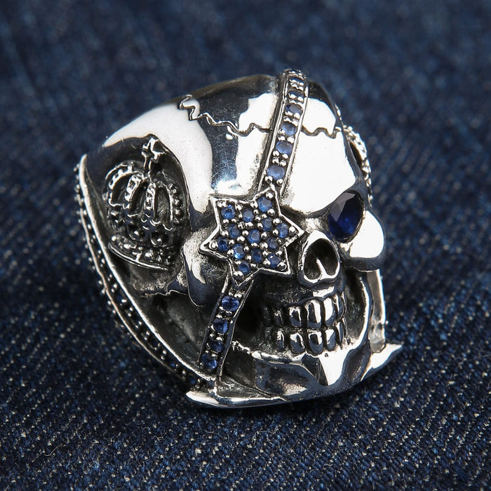 Angled view of the crown skull ring showing the star-shaped blue eye patch.