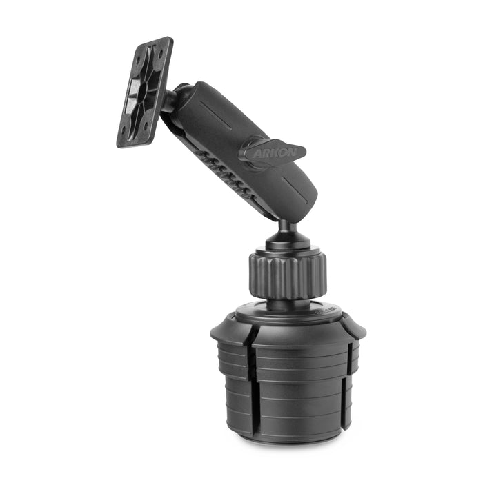 The AMPS Mounting Pattern with Cup Holder Mount is a black, adjustable car mount featuring a swivel arm and round ridged base, designed to securely hold devices like cameras or GPS units with versatile AMPS compatibility.