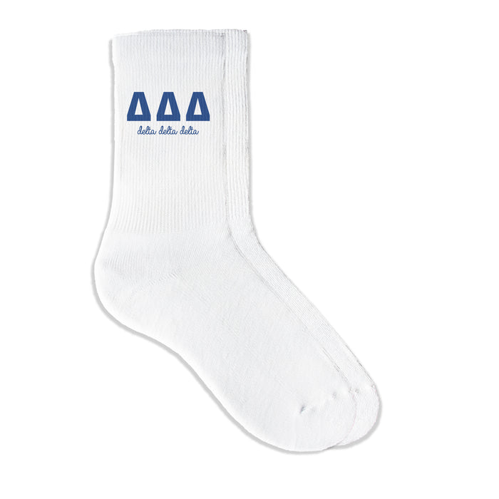 Delta Delta Delta sorority crew socks featuring Greek letters and sorority name on white sporty crew socks
