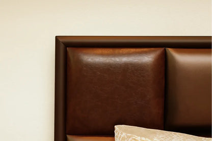 Brown padded bed headboard with quilted panels and top edge of bedding