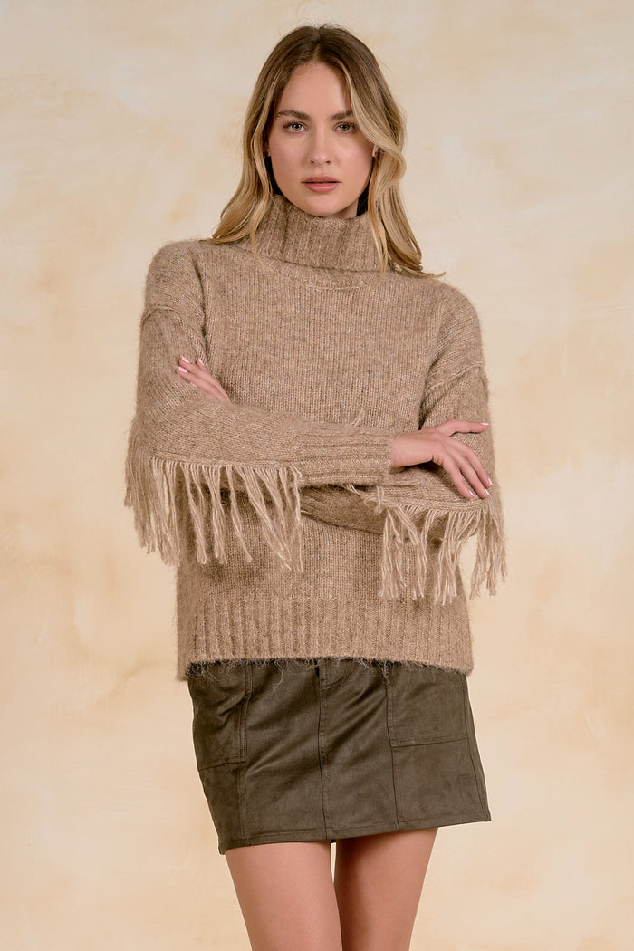Elan SWF11734 Turtleneck Fringe Sweater Natural Melange on model Shop Elan at Dotique