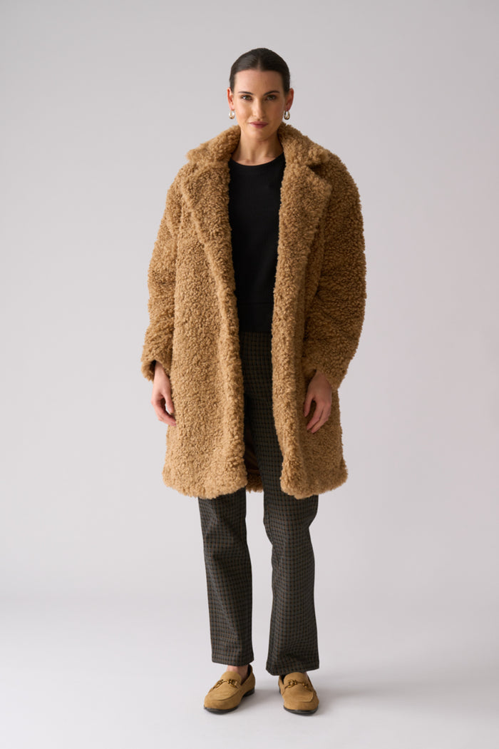 Model wearing Foil FO8385 Yogi Coat Nougat. Shop Foil at Dotique