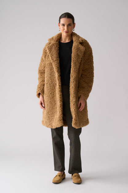 Model wearing Foil FO8385 Yogi Coat Nougat. Shop Foil at Dotique