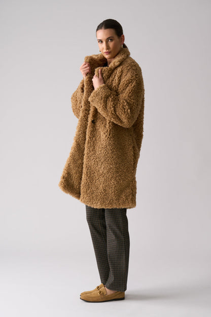 Model wearing Foil FO8385 Yogi Coat Nougat. Shop Foil at Dotique