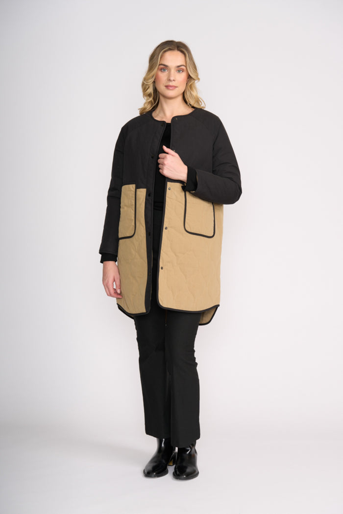 Model wears Foil FO8388 Hidden Talent Reversible Coat Black & Tan. Shop Foil at Dotique