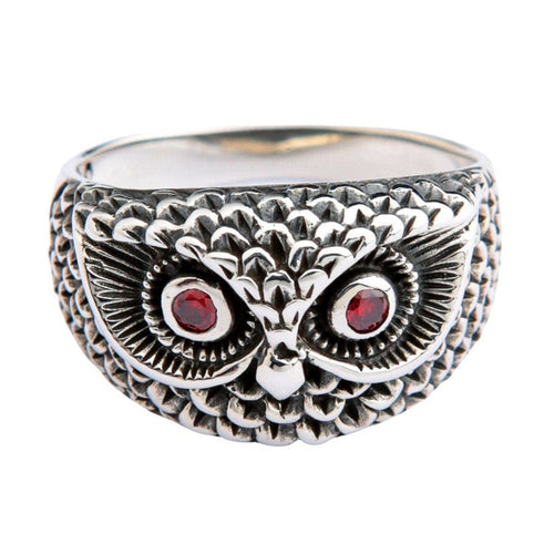 Sterling silver owl ring with red garnet eyes and detailed feather texture front view