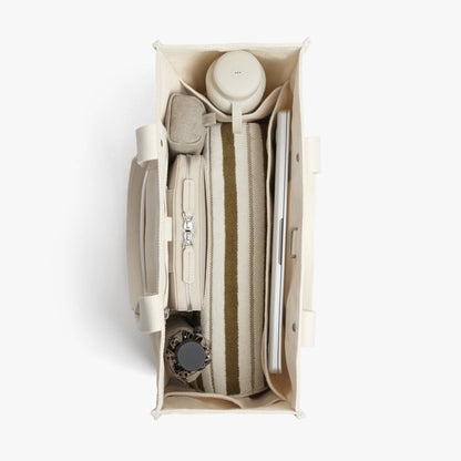 Ecru | Interior view of Gesso Tote in Ecru with folio kit and water bottle