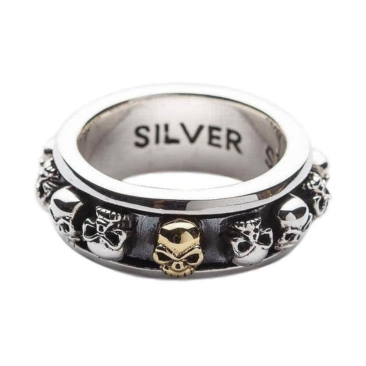 Front angle of the .925 sterling silver fidget ring highlighting the central gold skull on the spinning outer band.